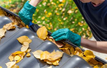 Man Cleaning Out Gutters Augusta GA