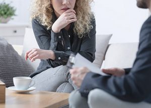 Woman taking to her lawyer about divorce mistakes