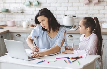 Woman with daughter coordinating a custody visitation with her ex spouse.