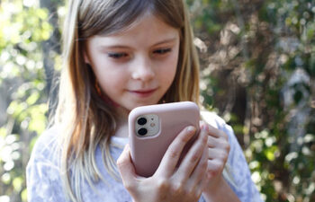 young girl taking video call for virtual visitation with parent