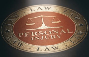 Personal Injury Law written with golden letters on the cover of a legal book